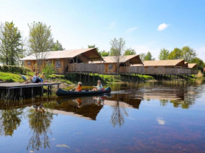 Glamping tent with kitchen near pond